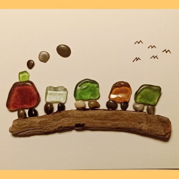 Quadretti realizzati con pietre, legno e vetri di mare